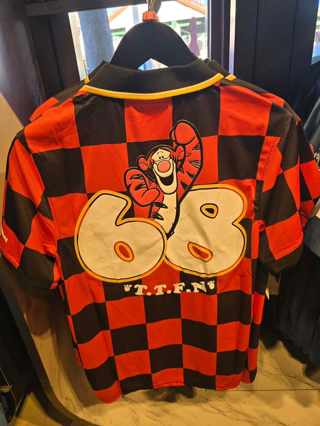 Disney Parks Tigger Football Jersey Featuring Black & Orange Checkerboard Pattern and V-Neck Collar