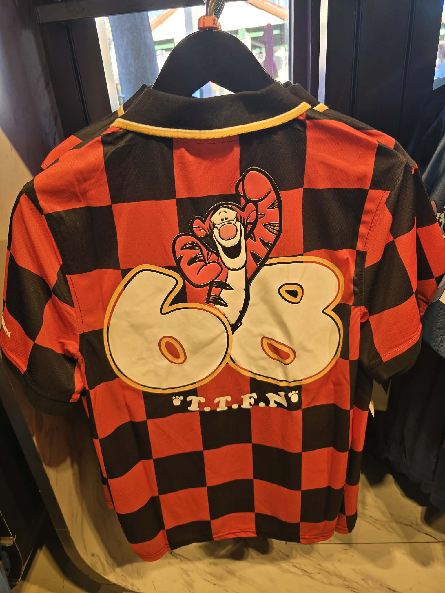 Disney Parks Tigger Football Jersey Featuring Black & Orange Checkerboard Pattern and V-Neck Collar